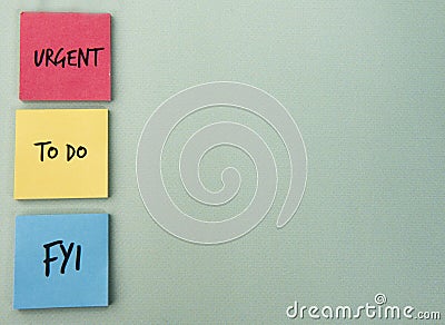 Urgent, to do and FYI written on note paper Stock Photo