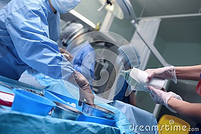 Urgent work of the surgical team in action Stock Photo