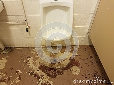 urinal and dirty bathroom floor or ground Stock Photo