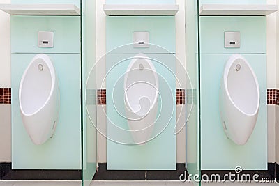 Urinals Men public in toilet room, wc Stock Photo