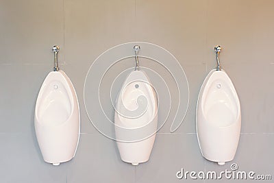 Urinals Men public in toilet room, wc Stock Photo