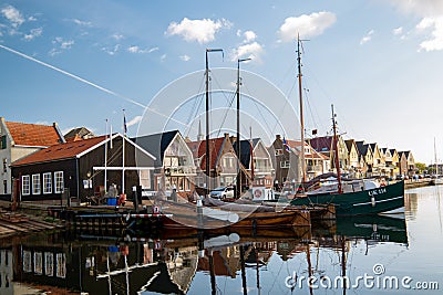 Urk Flevoland Netherlands a sunny spring day at the old village of Urk with fishing boats at the harbor Editorial Stock Photo