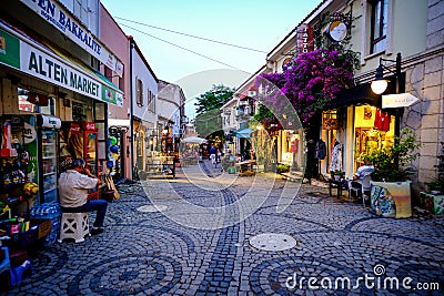 Urla, izmir, Turkey - June, 2023: Souvenir shops, cafes and people in Urla art street in izmir, Turkey. Editorial Stock Photo