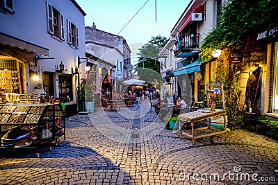 Urla, izmir, Turkey - June, 2023: Souvenir shops, cafes and people in Urla art street in izmir, Turkey. Editorial Stock Photo