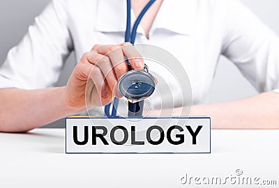 Urology concept. Urologist with stethoscope in hand treating patient. Doctor in lab coat diagnosing, curing kidneys Stock Photo