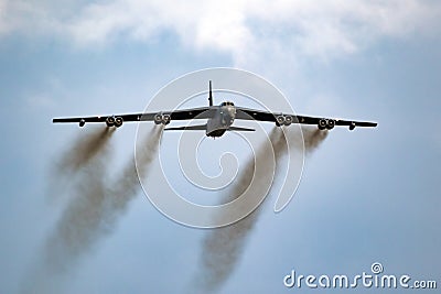 US Air Force Boeing B-52 Stratofortress bomber aircraft performing a low-pass at the Sanice Sunset Airshow. Belgium - September 13 Editorial Stock Photo