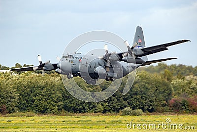 US Air Force Lockheed C-130H Hercules transport plane from 94th Airlift Wing landing on Eindhoven airbase. The Netherlands - Editorial Stock Photo