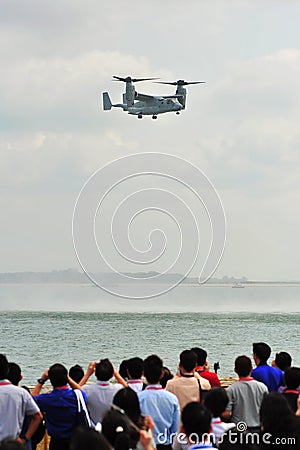 US Air Force (USFA) Bell Boeing MV-22 Osprey tilt rotor aircraft performing aerobatics at Singapore Airshow Editorial Stock Photo