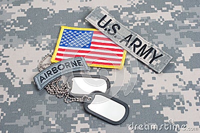 US ARMY airborne tab with blank dog tags on camouflage uniform Stock Photo