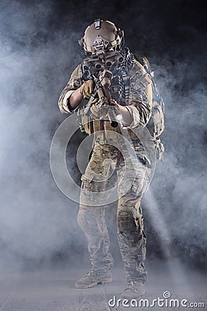 US Army Soldier in Action in the Fog Stock Photo