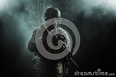 US Army soldier in the rain Stock Photo