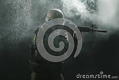 US Army soldier in the rain Stock Photo