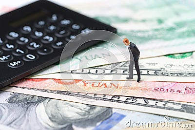 US and China finance economic direction, trade war, import and export deal and agreement concept, calculator with miniature leader Stock Photo