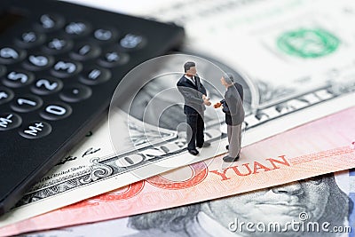 US and China finance economic direction, trade war, import and export deal and agreement concept, calculator with miniature leader Stock Photo