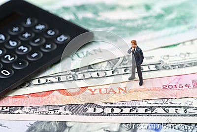 US and China finance economic direction, trade war, import and export deal and agreement concept, calculator with miniature leader Stock Photo