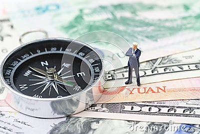 US and China finance economic direction, trade war, import and export deal and agreement concept, compass with miniature leader Stock Photo