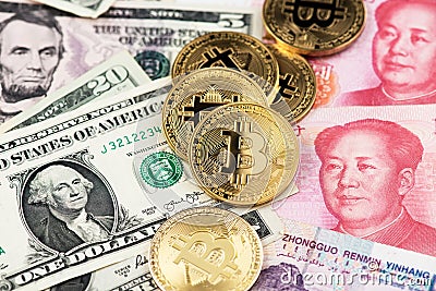Bitcoin Cryptocurrency coins and US Dollar and Yuan China currency banknotes. Stock Photo