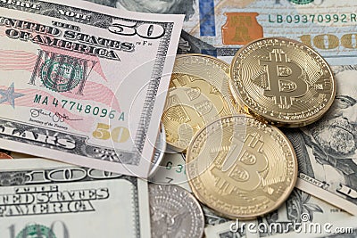 US Dollar Banknotes on top of Bitcoin coins. Crypto currency BTC and USD Cash. Digital Block chain technology Editorial Stock Photo