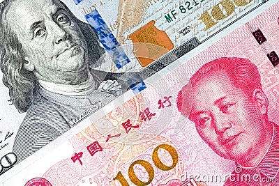 US dollar and China Yuan banknote .It is symbol of economic tariffs trade war and tax barrier between United States of America and Stock Photo