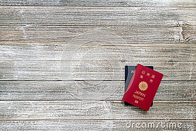 US and Japanese passport on a wooden desk Stock Photo