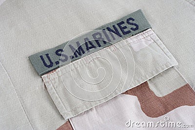 US MARINES branch tape with dog tags on desert camouflage uniform Editorial Stock Photo