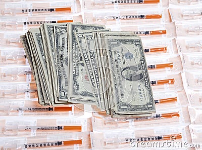 US money with syringes Stock Photo