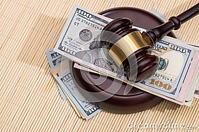 us money with wooden judges hammer on table Stock Photo