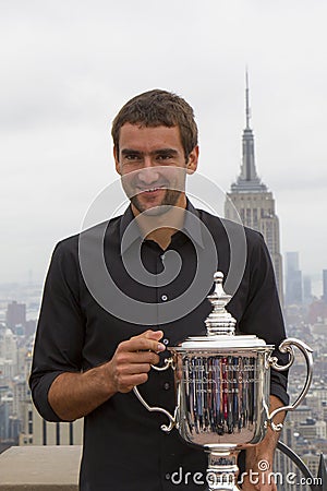 US Open 2014 champion Marin Cilic posing with US Open trophy on the Top of the Rock Observation Deck at Rockefeller Center Editorial Stock Photo