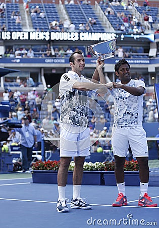 US Open 2013 men doubles champions Radek Stepanek from Czech Republic and Leander Paes from India during trophy presentation Editorial Stock Photo