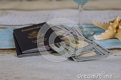 US passport with cash money and starfish, travel concept Stock Photo