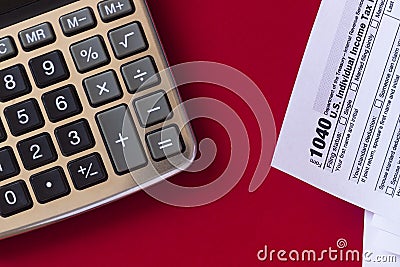 US tax form 1040 with calculator. Copy space Editorial Stock Photo