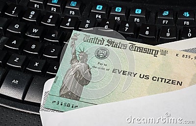 Illustration of the federal stimulus payment check from the IRS on keyboard Stock Photo