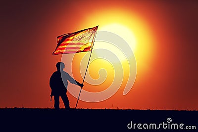 USA army soldier with flag on sunset background Stock Photo