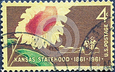 USA - Circa 1961 : a postage stamp printed in the US showing a sunflower, and a pioneer family with a covered wagon and stockade.T Editorial Stock Photo