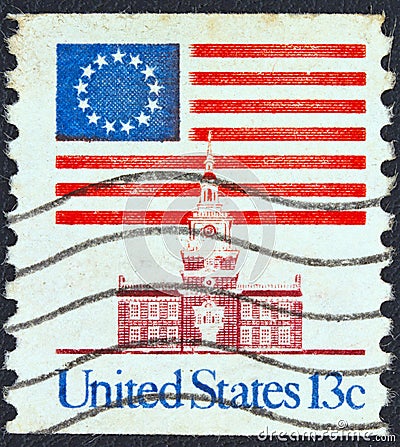 USA - CIRCA 1975: A stamp printed in USA showing 13 star flag over Independence Hall, circa 1975. Editorial Stock Photo