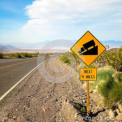 USA. Death valley. Sign at the road steep descent. Stock Photo