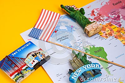 Usa flag and magnets from new york and san francisco over world map with pins Stock Photo