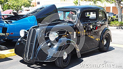 Side view of exotic antique car with kidney grills and double door engine doors Editorial Stock Photo