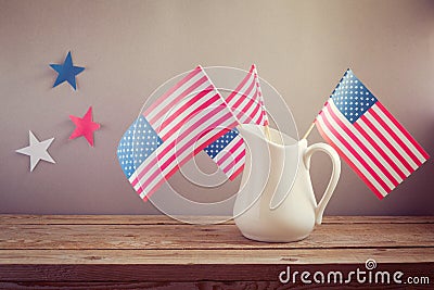 USA independence day celebration. USA flags in jug on wooden table Stock Photo