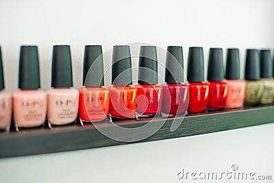 Usa, la - january, 2020 colorful nail polish colors in a row at nails saloon on white background Editorial Stock Photo