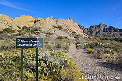 `Fillmore Canyon. La Cueva. The cave` sign on mountain landscape with prickly pear cacti, New Mexico Editorial Stock Photo