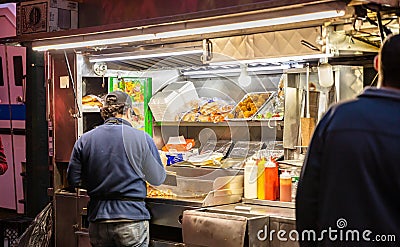 New York, Broadway at night. Take away fast food kiosks selling hot dog Editorial Stock Photo
