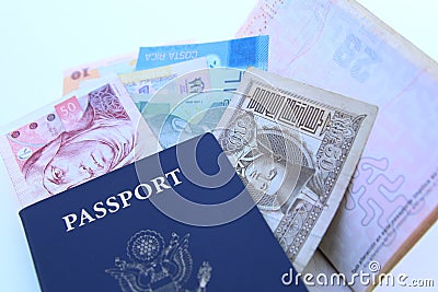 USA passport and international currencies Stock Photo