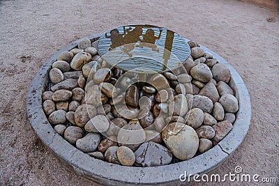 USA, PHENIX, ARIZONA- NOVEMBER 17, 2019: original small round fountain with fresh water at the entrance to the Phoenix Desert Editorial Stock Photo