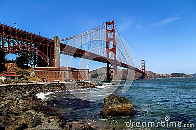 USA San Francisco June 2018: Photo of the attractions of the Golden Gate Bridge near the water with waves Stock Photo
