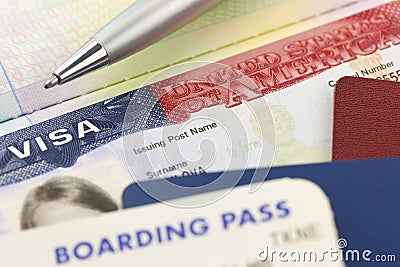 USA Visa, passports, boarding pass and pen - foreign travel Stock Photo