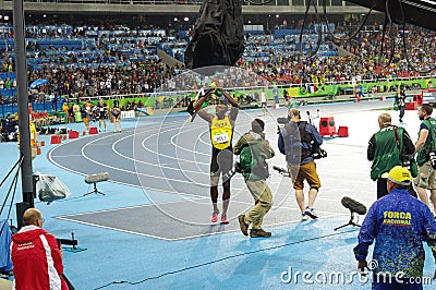 Usain Bolt celebrates winning 200m at Rio2016 Editorial Stock Photo