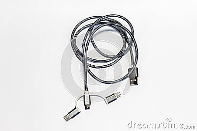 USB cable with different types of adapters. Various USB, USB Type-C to Lightning, mini-connectors on a white background, top view Stock Photo