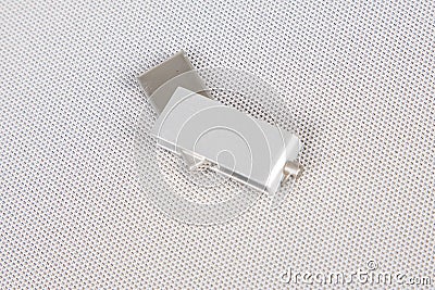 USB flash memory stick key with a silver lid on white background Stock Photo