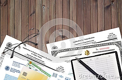 USCIS form I-485 Application to register permanent residence or adjust status and N-400 Application for naturalization with Editorial Stock Photo